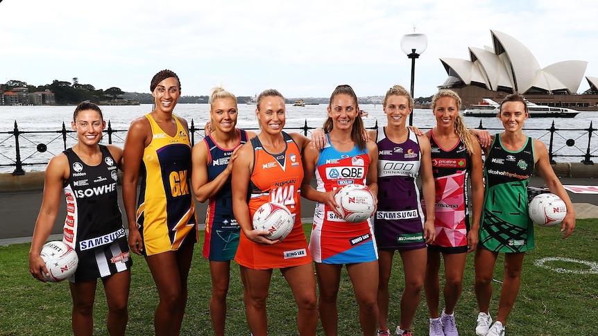 Captains from each Super Netball team pose together with the Sydney Opera House in the background