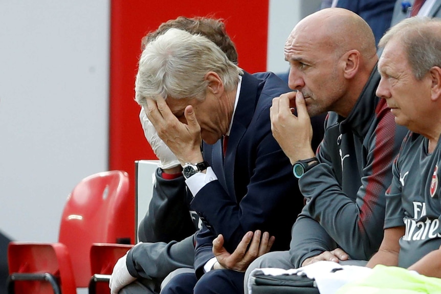 Arsene Wenger grimaces during loss to Liverpool