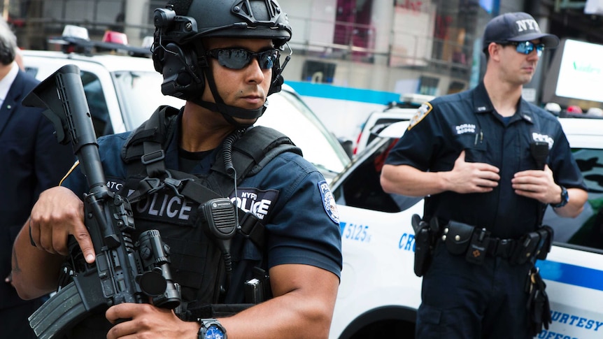 Members of the NYPD counterterrorism unit stand guard in Time Square.