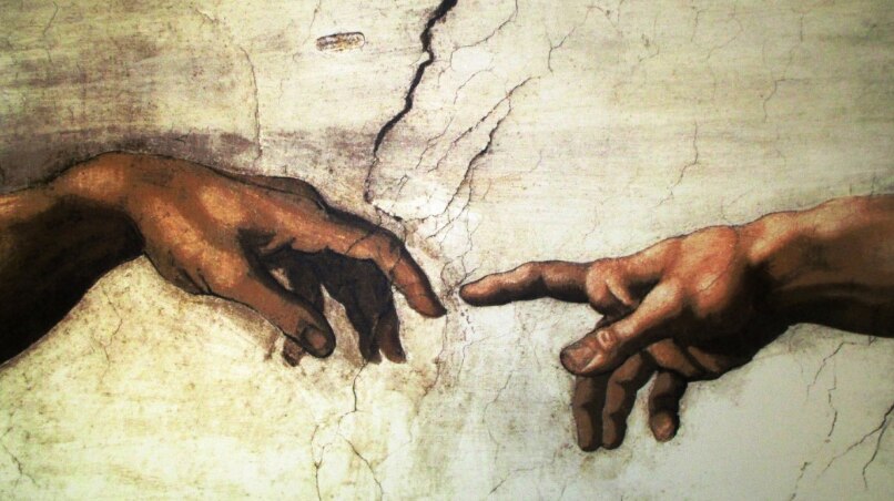 Close up of hands from Michelangelo painting