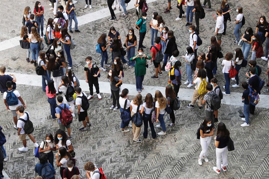 A shot of students in masks seen from above.