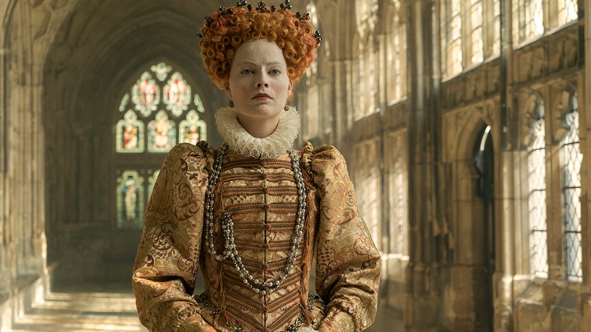Colour still of Margot Robbie Queen Elizabeth I in 2018 film Mary Queen of Scots.
