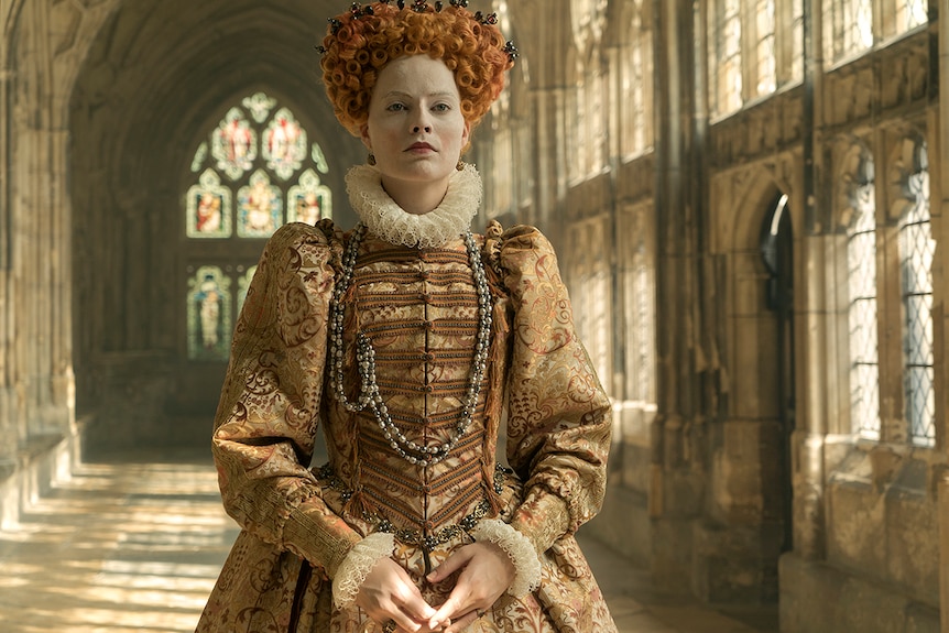 Colour still of Margot Robbie Queen Elizabeth I in 2018 film Mary Queen of Scots.