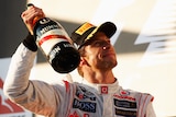 Jenson Button enjoys the taste of victory in Melbourne again.