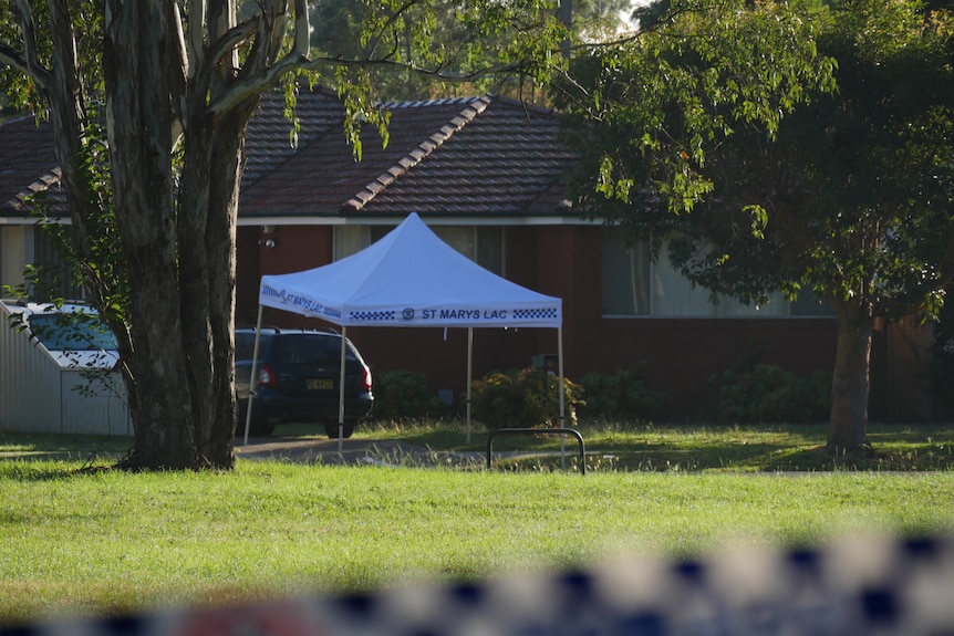 A police tent over a driveway on Stafford Street in Kingswood.