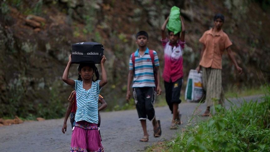 Mudslides triggered by monsoon rains sweep through a tea-growing region of Sri Lanka