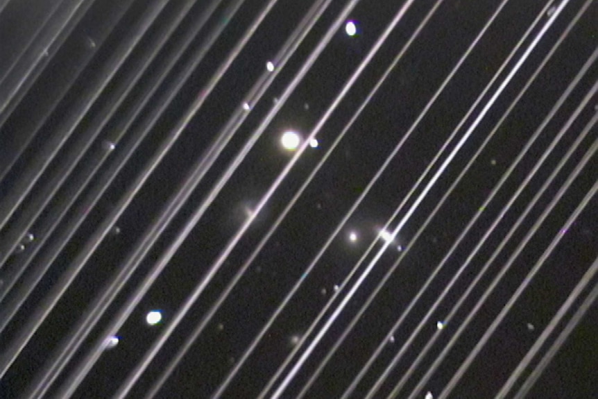 An image of Starlink satellite streaks in the sky.