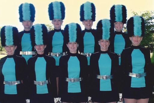 Two lines of dances in uniforms.