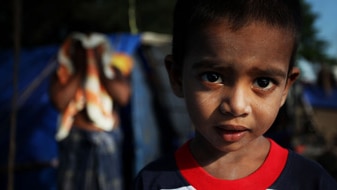 A young Sri Lankan Asylum seeker waits to be relocated on April 14, 2010 in Merak, Banten Province, Indonesia. (Getty Images:...