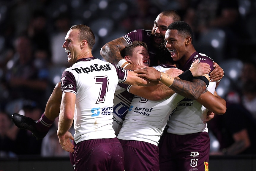 Daly Cherry-Evans celebrates with Manly teammates