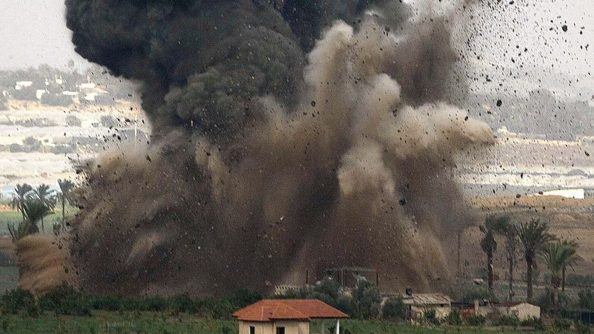 An Israeli bomb explodes during an air strike on a targeted location inside the northern Gaza Strip