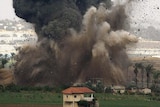 An Israeli bomb explodes during an air strike on a targeted location inside the northern Gaza Strip