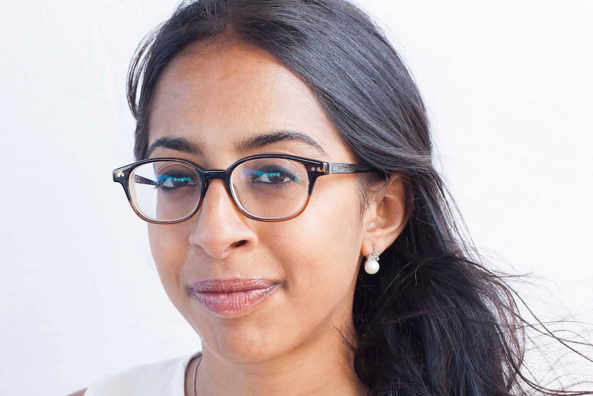 A woman with glasses on a white background