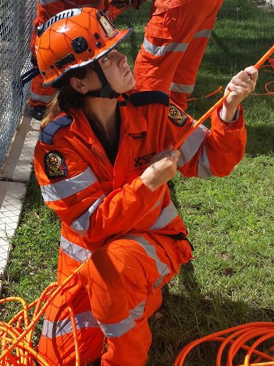 Yeppoon SES volunteer pulls on a rope during working at heights training