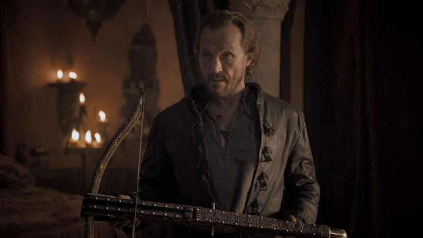 Bronn holds a crossbow.