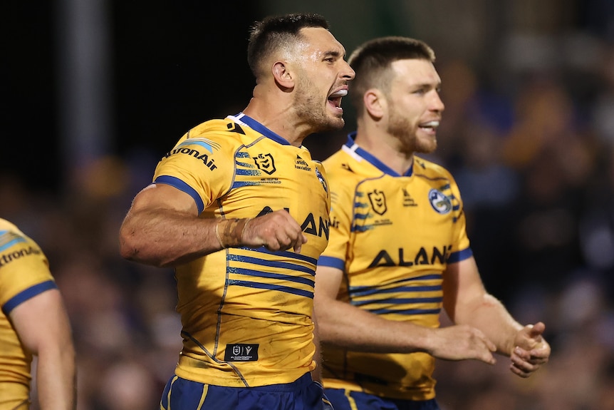 A rugby league player celebrates during a game 