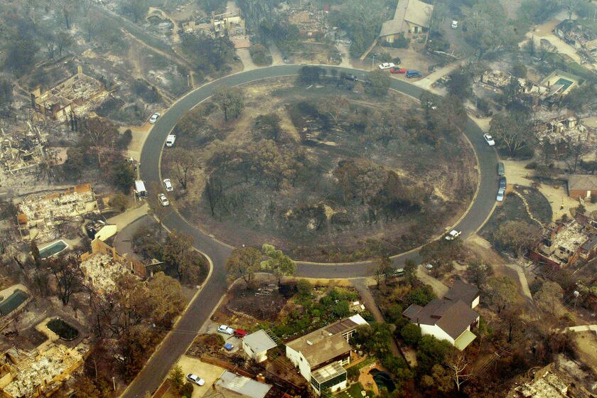 An aerial view of a fire-devastated Chauvel Circle in the Canberra suburb of Chapman in 2003