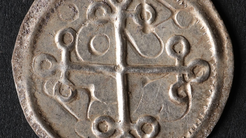 Close up of silver Viking coin. 