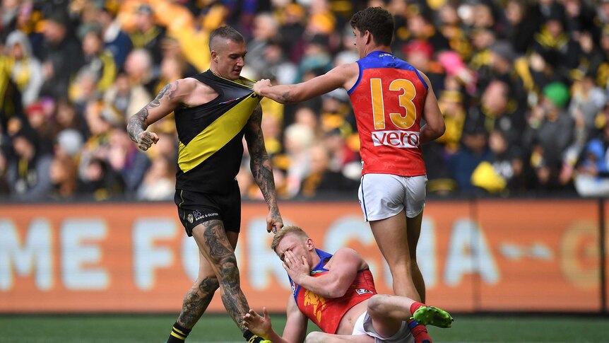 Dustin Martin stands over his foe, Nick Robertson
