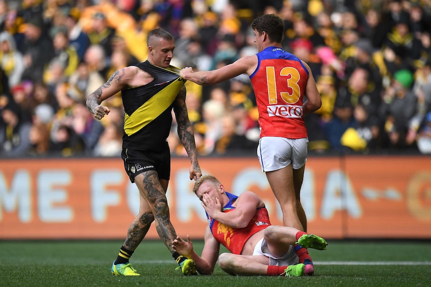 Dustin Martin stands over his foe, Nick Robertson