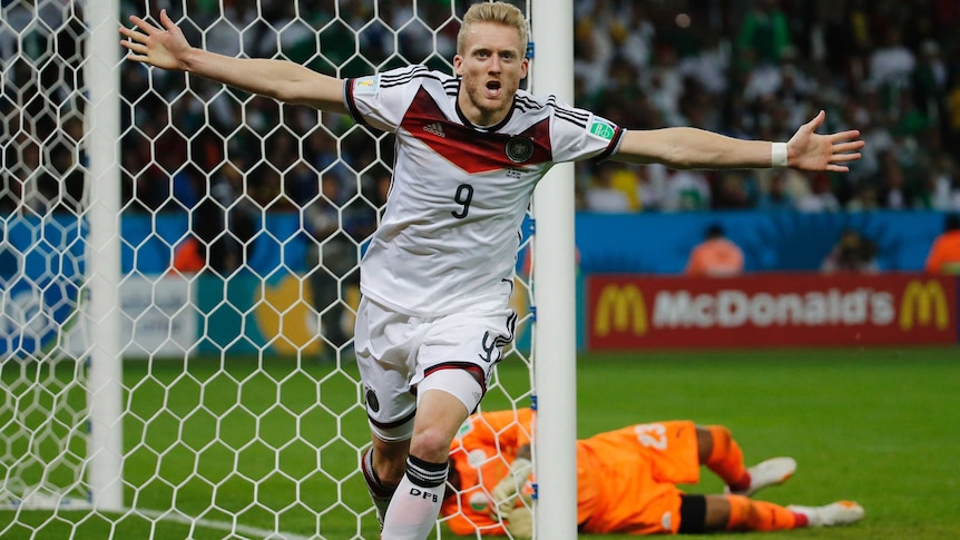 Andre Schuerrle wheels away after scoring for Germany
