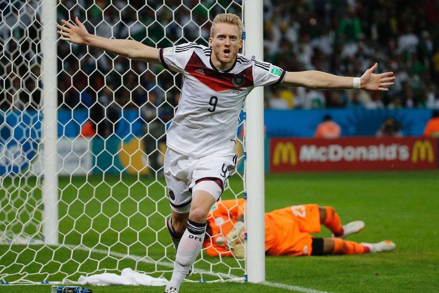 Andre Schuerrle wheels away after scoring for Germany