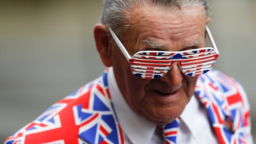 Man decked out in union jacks celebrates new royal princess arrival