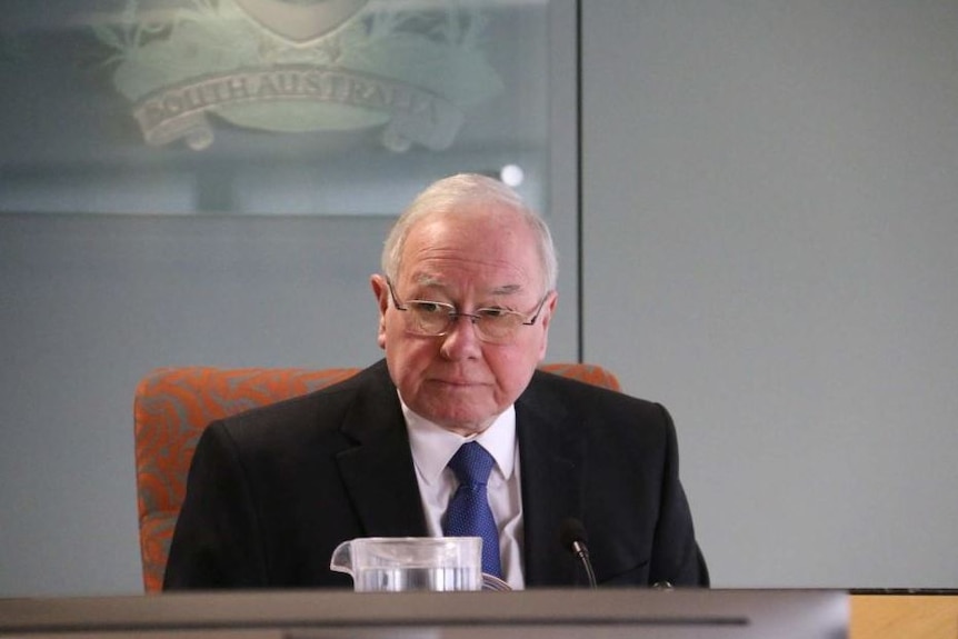 ICAC Bruce Lander sitting at desk