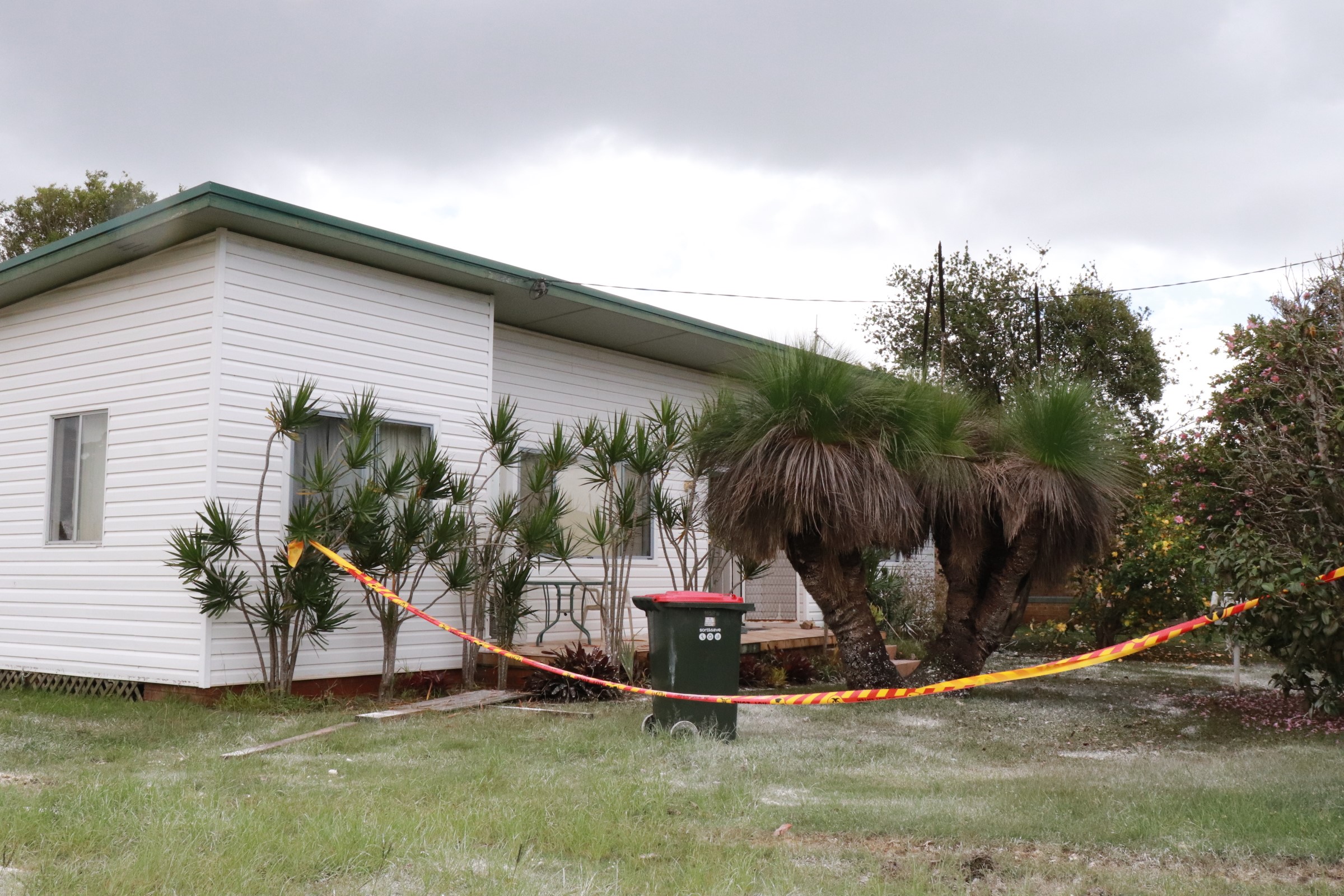 A house cordoned off with a tape.