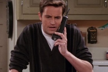 Chandler from Friends waves hands in air