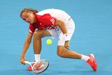 Injury concern ... Alexandr Dolgopolov plays a forehand against Gilles Simon (Chris Hyde: Getty Images)