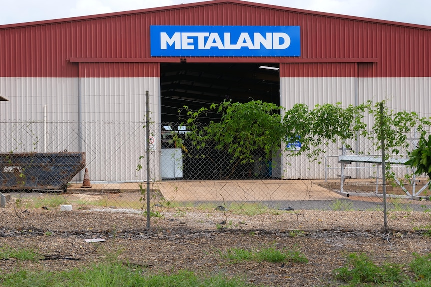 a big shed with a Metaland sign on it