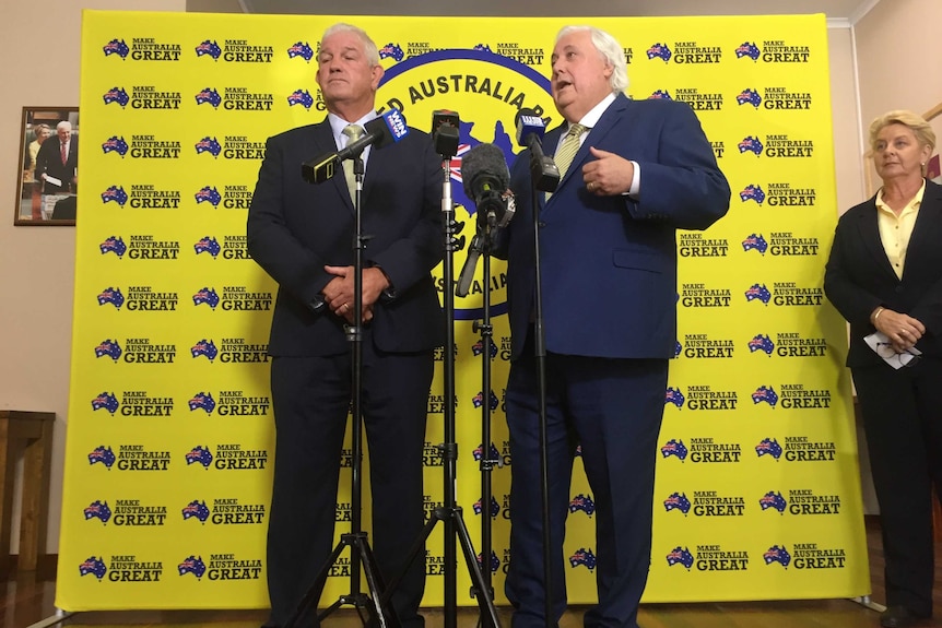United Australia Party candidate for Herbert Greg Dowling and party founder Clive Palmer stand at a press conference