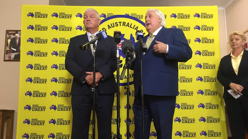 United Australia Party candidate for Herbert Greg Dowling and party founder Clive Palmer stand at a press conference