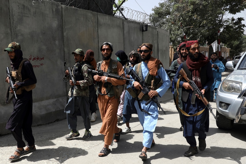 Taliban fighters patrol in Wazir Akbar Khan neighbourhood in the city of Kabul