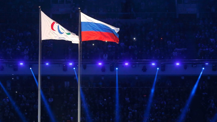 The Paralympic and Russian flags fly side by side at the Sochi Winter Olympics opening ceremony