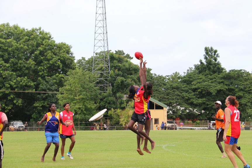 Female footballers from Bathurst and Melville Islands compete at Tiwi Islands Grand Final