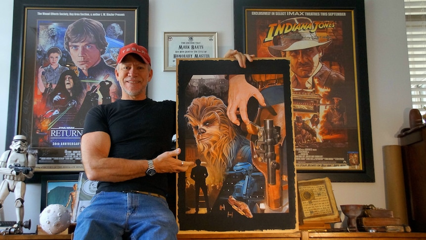 Mark Raats with the final painting he made for Solo