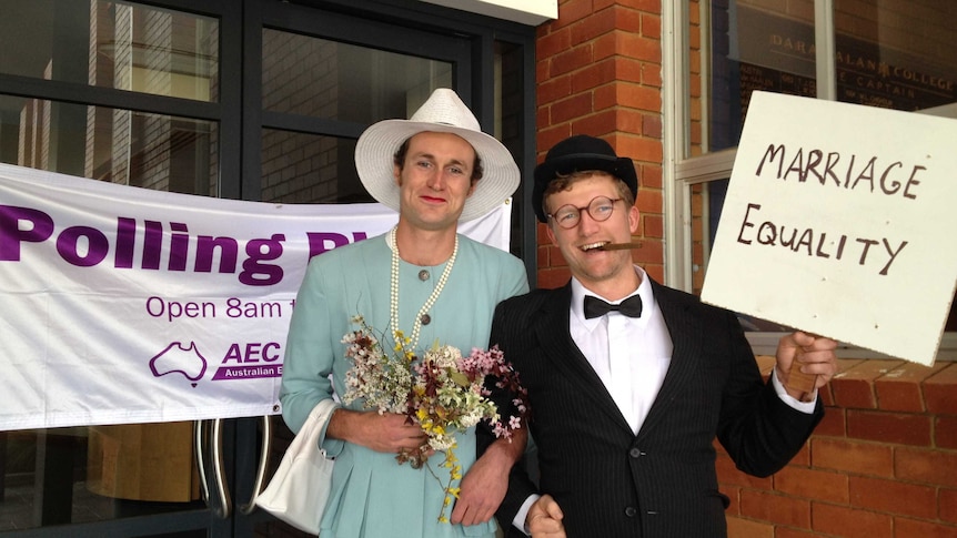 Same-sex marriage advocates get into the spirit at a polling booth in the electorate of Fraser in the ACT on election day