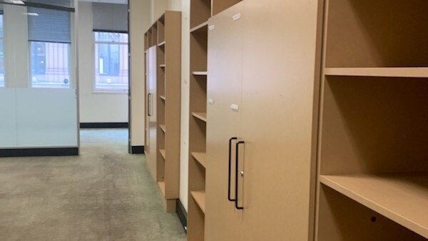 An empty office with empty shelves.