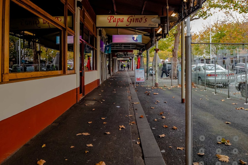 Empty Lygon Street footpath in front of Papa Gino's restaurant