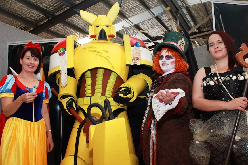 A woman dressed as snow white, a megatron Pikachu, Mad Hatter.