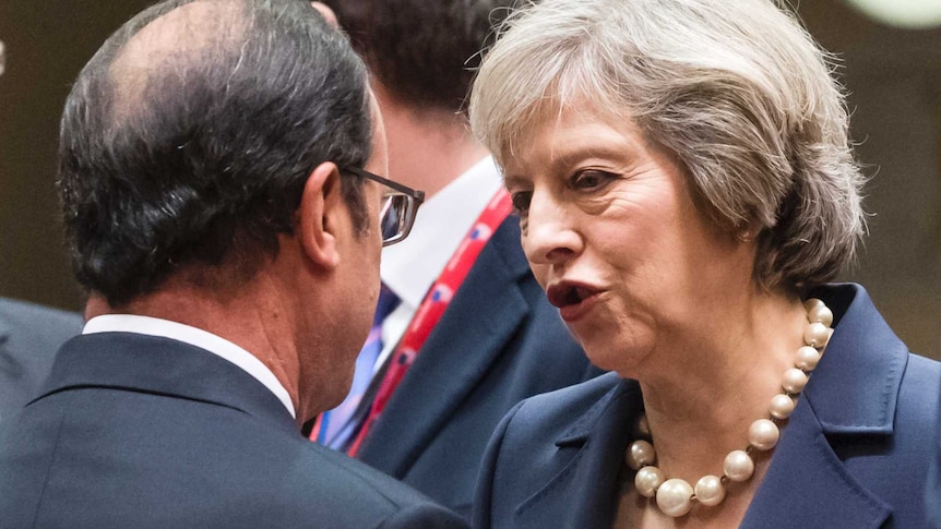 British PM Theresa May talks with French President Francois Hollande.
