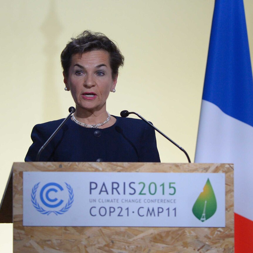 Christiana Figueres at podium at UN conference in Paris