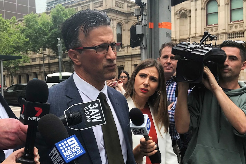 Sandro Cirianni speaking to journalists in a doorstop outside court.