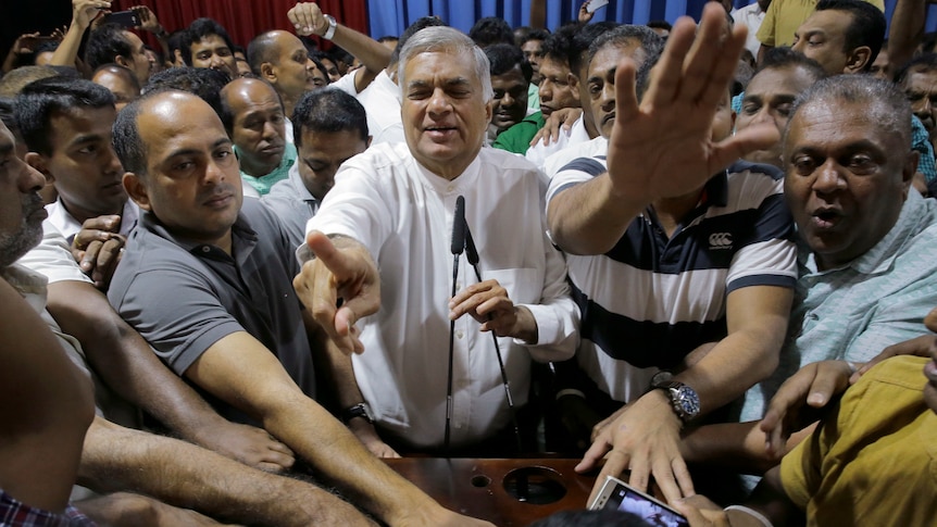 Ousted Prime Minister Ranil Wickremesinghe with supporters