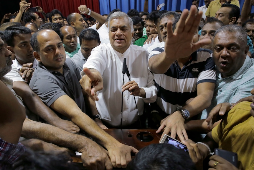 Ousted Prime Minister Ranil Wickremesinghe with supporters