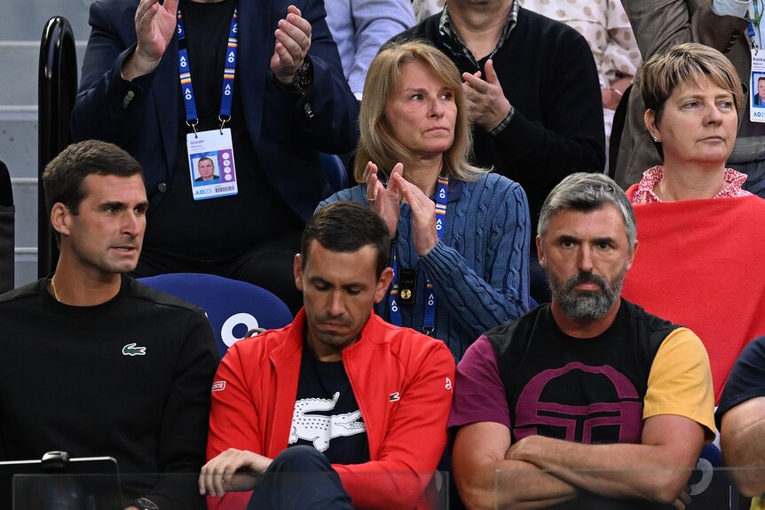 Novak Djokovic's player's box showing an empty seat.