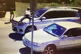 Woman throws herself onto bonnet