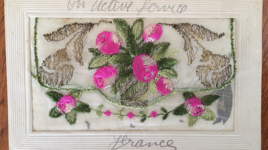 Hand embroidered postcard with pink flowers